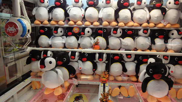 pingu and pinga plush toys in a crane game